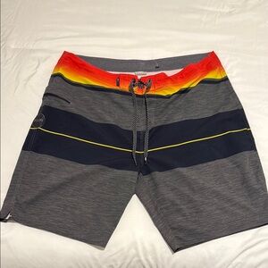 Rip Curl Mirage Gray and Red Board Shorts with Color-Blocked Design